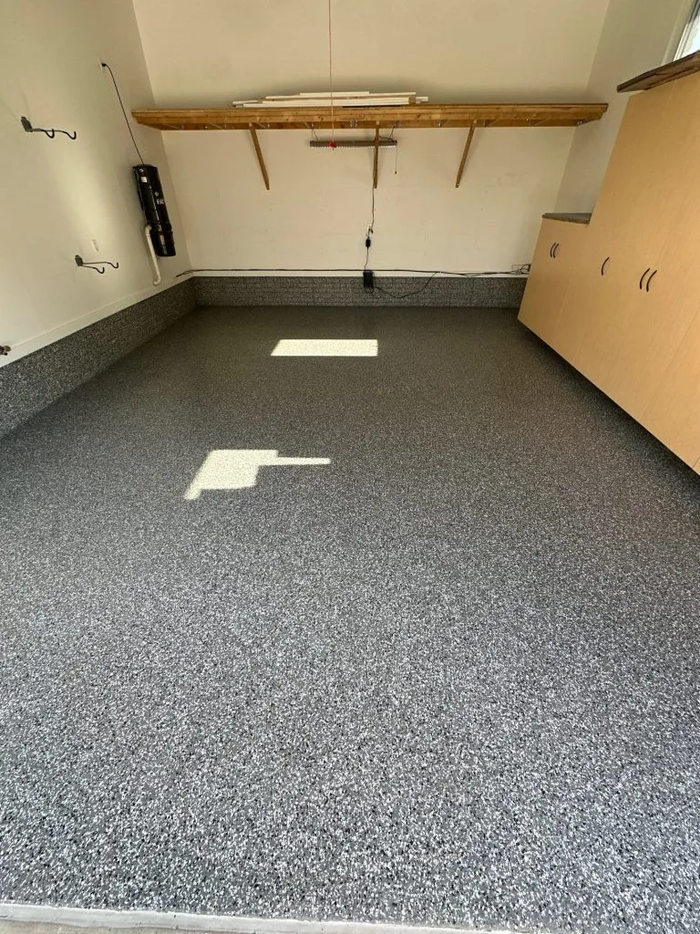 Residential garage with a fresh chip-system concrete floor coating